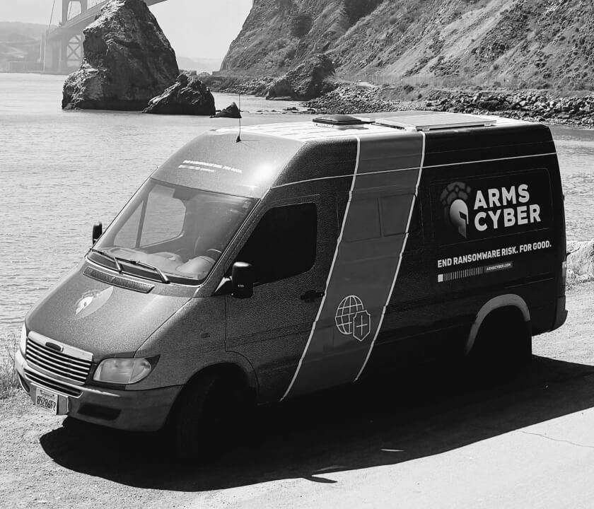 Arms Cyber company van sitting in front of the San Francisco bridge